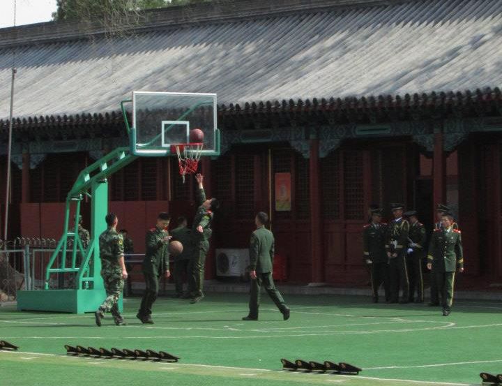 Chinese officials playing basketball